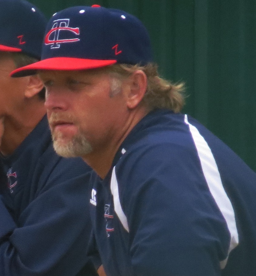Michael Hoog coaching in the dugout at Skyline High School